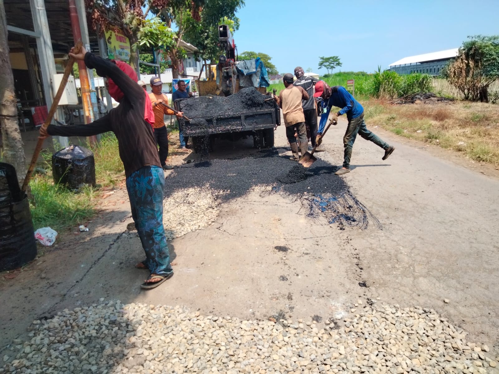PERBAIKAN JALAN SABRAWI